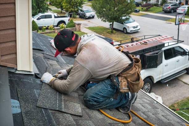 Professional Roofing technician working in Peru, NE